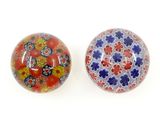 pair of red, blue, and yellow glass buttons with flowers