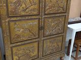 a wooden cabinet that has many drawers on it