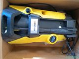 a box that has a yellow and black vacuum in it