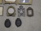 a lot of picture frames and mirrors on the floor