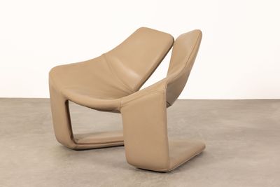 an image of a chair that is sitting on a concrete floor
