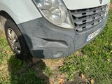 a white van that is parked in the grass