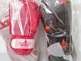 two pairs of boxing gloves wrapped in plastic bags