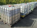many containers that are sitting on the side of the road