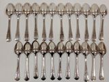 a lot of spoons that are sitting on a table