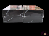 two boxes that are sitting side by side on a black background