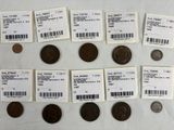 some coins are sitting on a table with labels on them