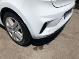 a white car that is parked in a parking lot