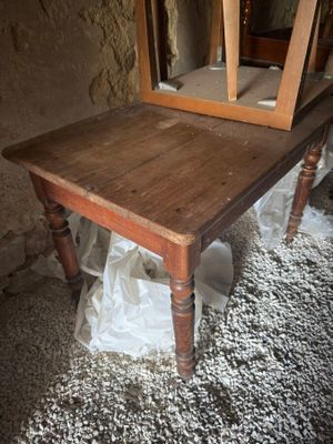 a wooden table with a mirror on top of it
