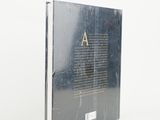 the front cover of a book with a black cover and gold letters