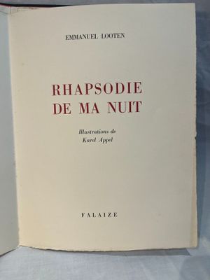 two books sitting on top of a white table next to each other