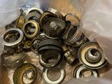 a lot of metal buttons in a bag on a table