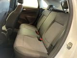 a seat in the back of a car with a remote control
