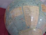 a large globe with a map on it on a table