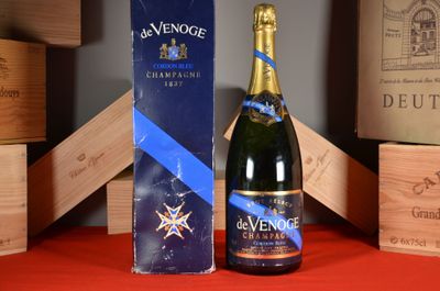 a bottle of wine sitting next to a box of wine