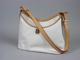 the purse is white and brown with a brown strap