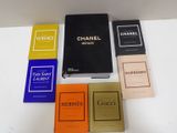 several books are lined up on a white table