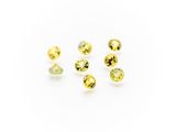 a group of yellow sapphires on a white background