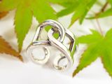 sterling silver ring with a green stone in the middle of it