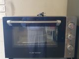 a microwave sitting on top of a washer and dryer