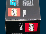 a box of legos sitting on a blue surface