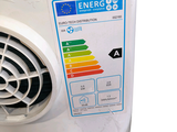 a white air conditioner with an energy label on the side of it