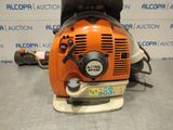a close up of a chainsaw sitting on top of a table