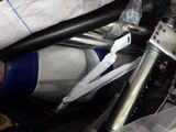a close up of a motorcycle with a bunch of items in it