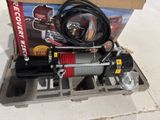a box that has a winch and a hose on it