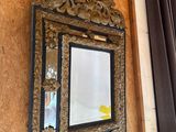a mirror hanging on the wall next to a mirror