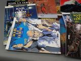 a lot of comic books sitting on a table