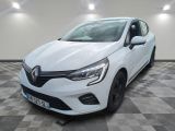 a white car parked in a garage with a checkered floor