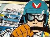 a picture of a man driving a car with a helmet and goggles on