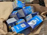 a large pile of boxes in the middle of a warehouse