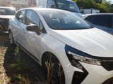 a white car that is parked next to other cars