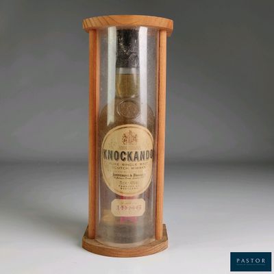 a bottle of whisky in a wooden case