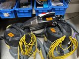 two vacuums that are sitting on the floor next to some boxes