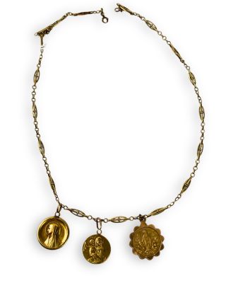 a close up of a necklace on a white background