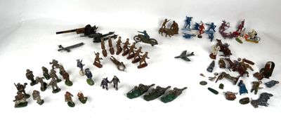 a lot of toy soldiers that are on a white surface