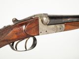 a close up of a rifle with a gun on it ' s side