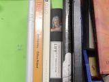 many books that are sitting in a blue box