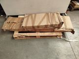a pile of cardboard sitting on top of a pallet