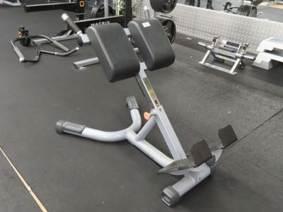 a gym equipment that is sitting on the floor in the gym