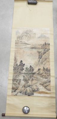 chinese scroll with a painting of a mountain scene on it