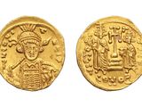 a gold coin with an image of a man holding a basket