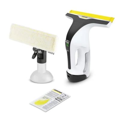 un gros plan sur un aspirateur jaune et noir et un chiffon de nettoyage