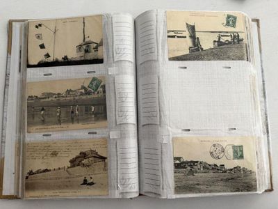 un livre ouvert sur lequel sont posées plusieurs vieilles photos