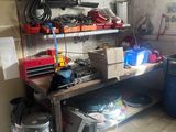 a workbench in a garage with tools on it