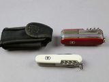 a swiss army knife and a wallet on a table