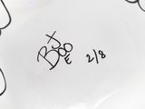 a close up of a white plate with black writing on it
